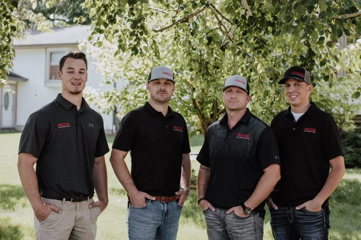 The Revive Roofing & Restoration crew outside a completed project