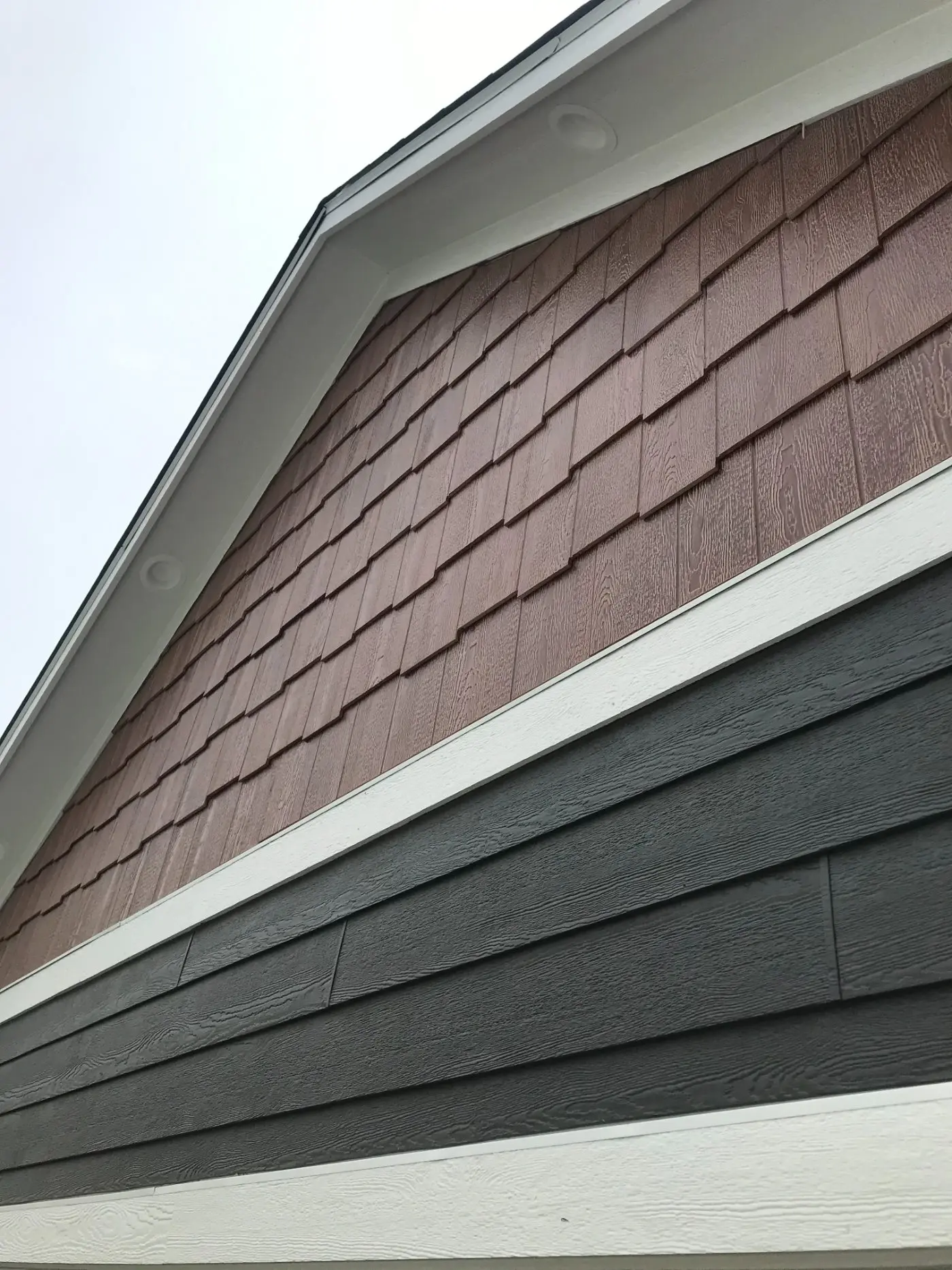 Roof replacement in progress with underlayment exposed