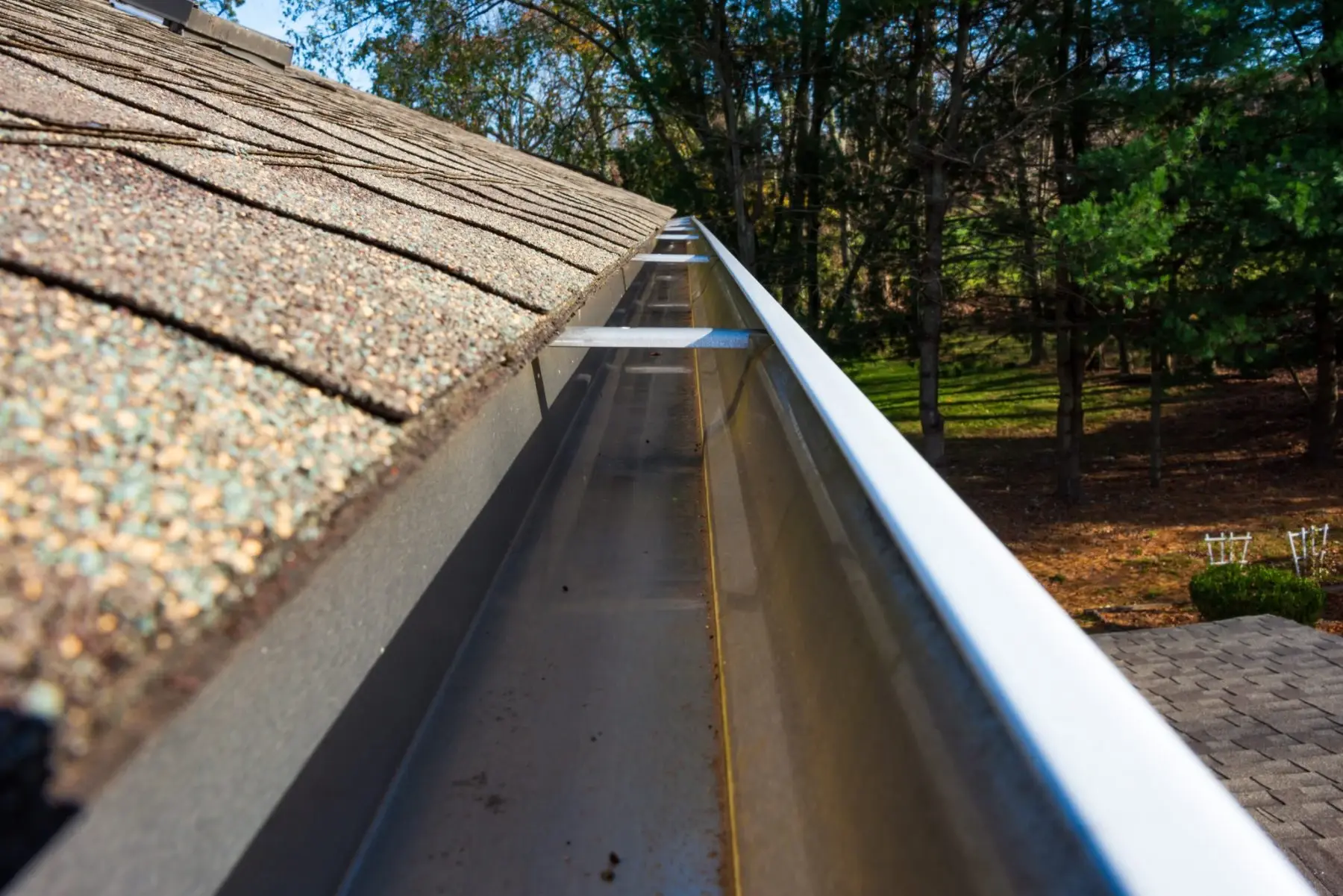 Seamless gutter installed along a residential roofline