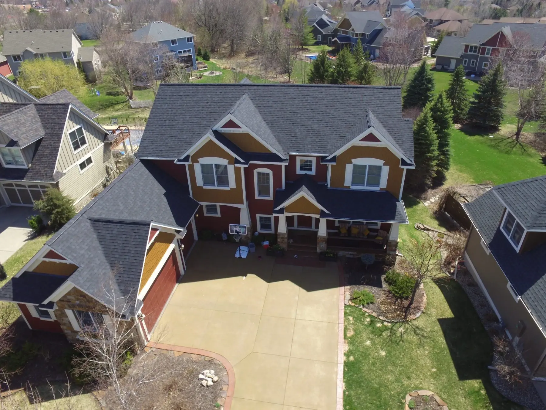 Revive crew installing a new asphalt shingle roof on a Hudson home