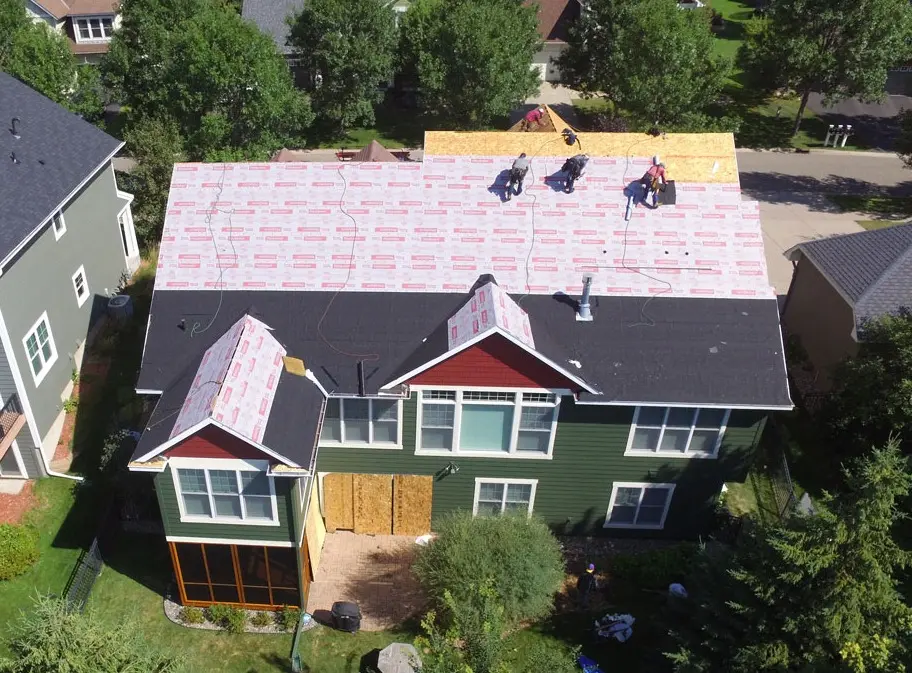Ice and water shield being installed along a roof valley