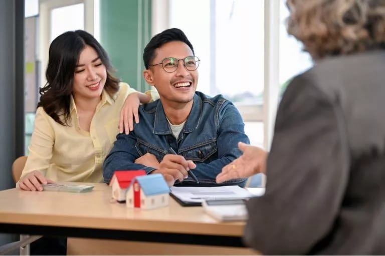 Lovely Asian couple meets with their house insurer agent